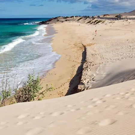Casitas De Коральео